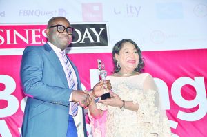 L-R: Charle Aigbe, divisional head marketing & corporate relations, United Bank for Africa Plc  receiving best bank in support of agriculture award from Nike Akande, president, LCCI