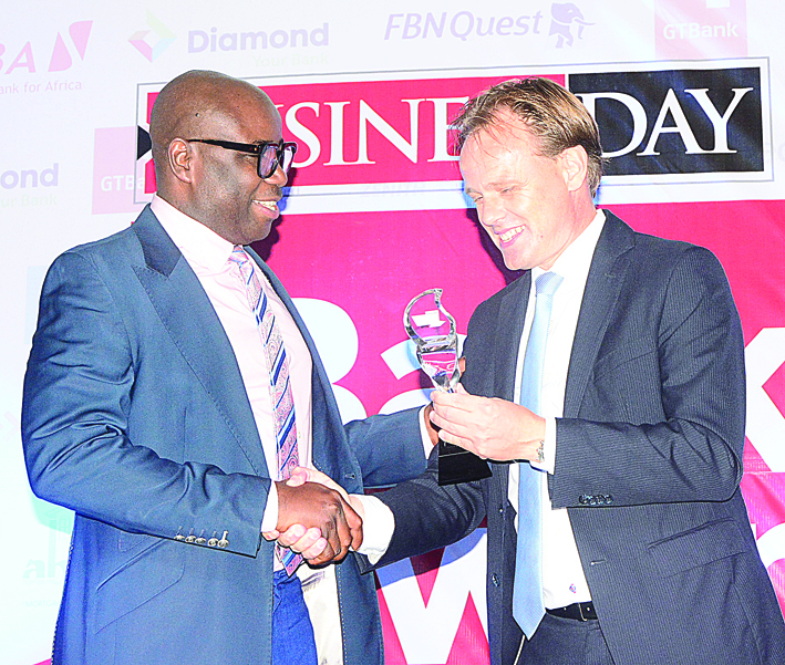 L-R Charles Aigbe ,divisional head, marketing and corporate relations UBA, receiving best Nigerian bank in sub Saharan Africa award from Edwin Visser , regional financial director, Nigeria and Ghana .