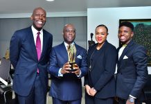 L:R: Group Head Corporate Communications, Access Bank, Plc, Amaechi Okobi; Group Managing Director/Chief Executive Officer Access Bank Plc, Herbert Wigwe, Group Head Accelerate TV, Colette Otusheso and Winner of Best Short Film/Online Video, Africa Magic Viewers' Choice Awards (AMVCA), Micheal Ama Psalmist Akinrogunde presenting the award at Access Bank Headquarters.