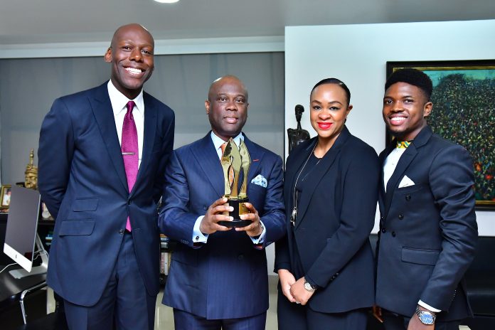 L:R: Group Head Corporate Communications, Access Bank, Plc, Amaechi Okobi; Group Managing Director/Chief Executive Officer Access Bank Plc, Herbert Wigwe, Group Head Accelerate TV, Colette Otusheso and Winner of Best Short Film/Online Video, Africa Magic Viewers' Choice Awards (AMVCA), Micheal Ama Psalmist Akinrogunde presenting the award at Access Bank Headquarters.