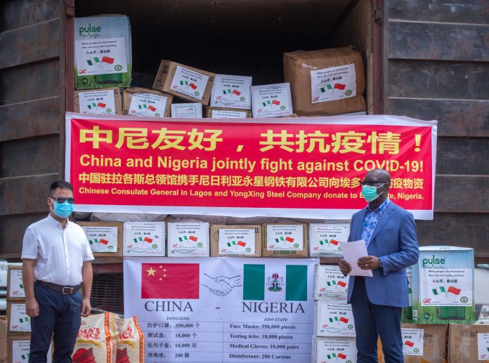 Edo State Governor, Mr. Godwin Obaseki (right) receiving items from Managing Director, Yongxing Steel Company Limited, XiangHai Zhang; at the Government House, in Benin City, on Wednesday, April 29, 2020. COVID19